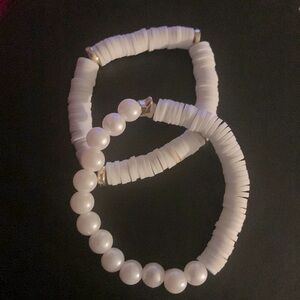 Gold and white bracelets